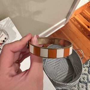 White and orange coach bracelet